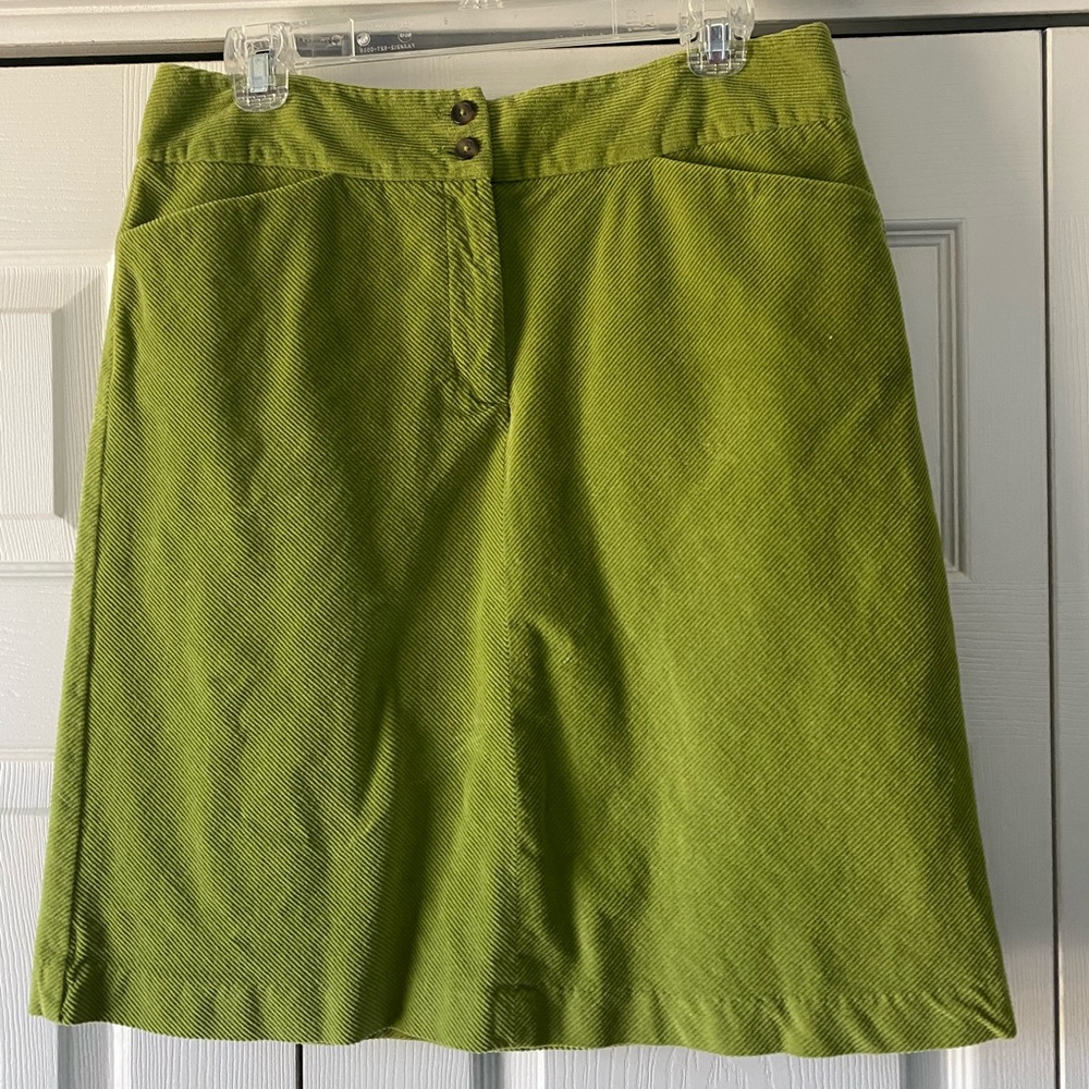 Knee length green corduroy skirt